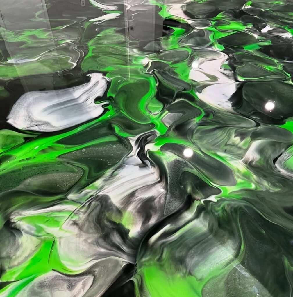 Metallic epoxy flooring with green and black design in Murrieta and Temecula California